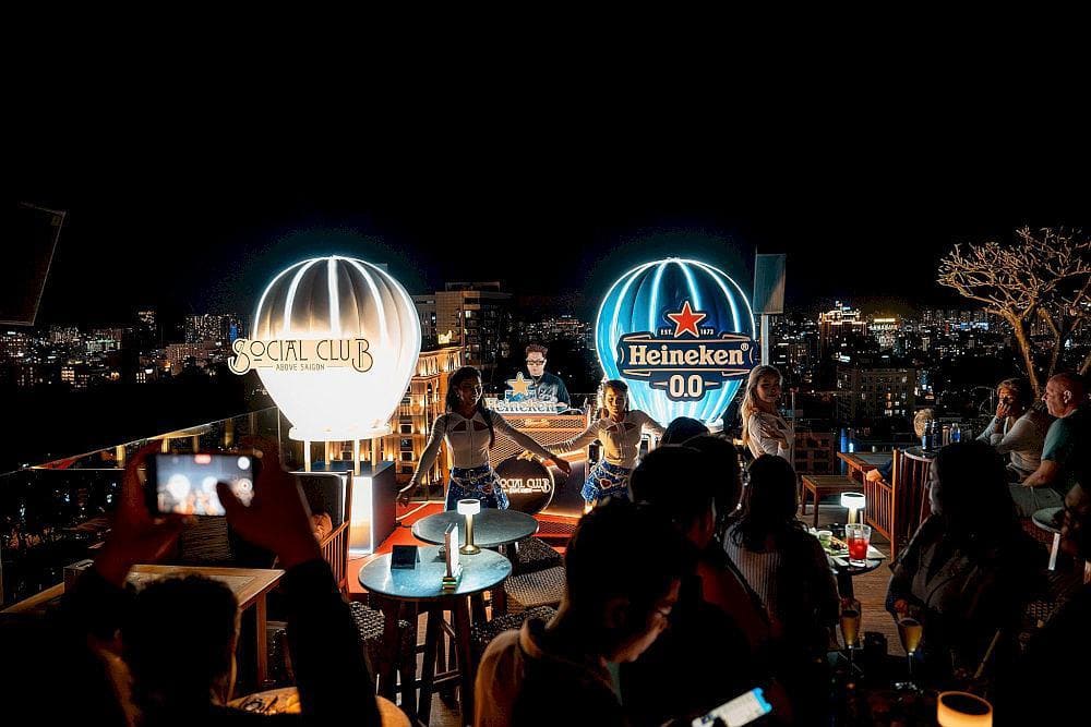 The outdoor stage features cutting-edge sound, where DJs and dancers set the Saigon night ablaze with energy and light (Source: Social Club Rooftop Bar)